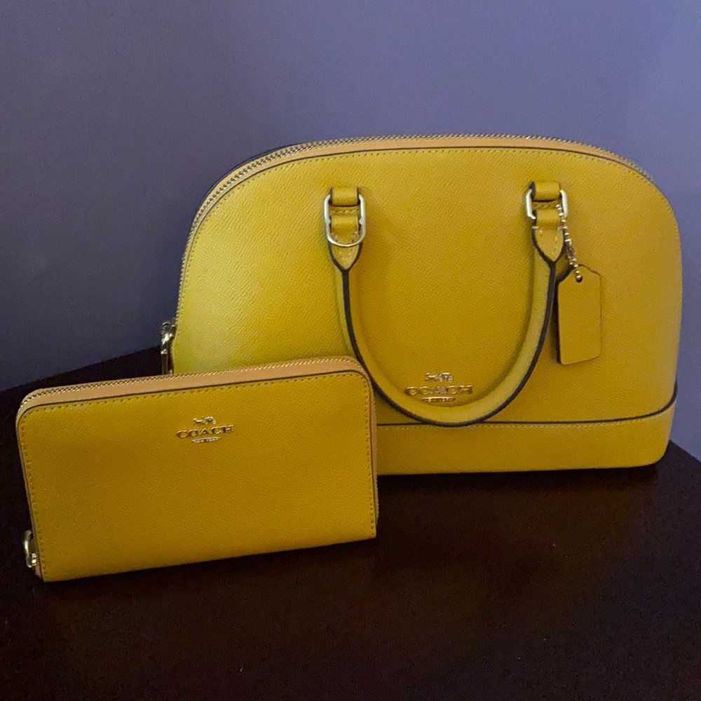 Authentic gold Coach mini bag with wallet and tag.